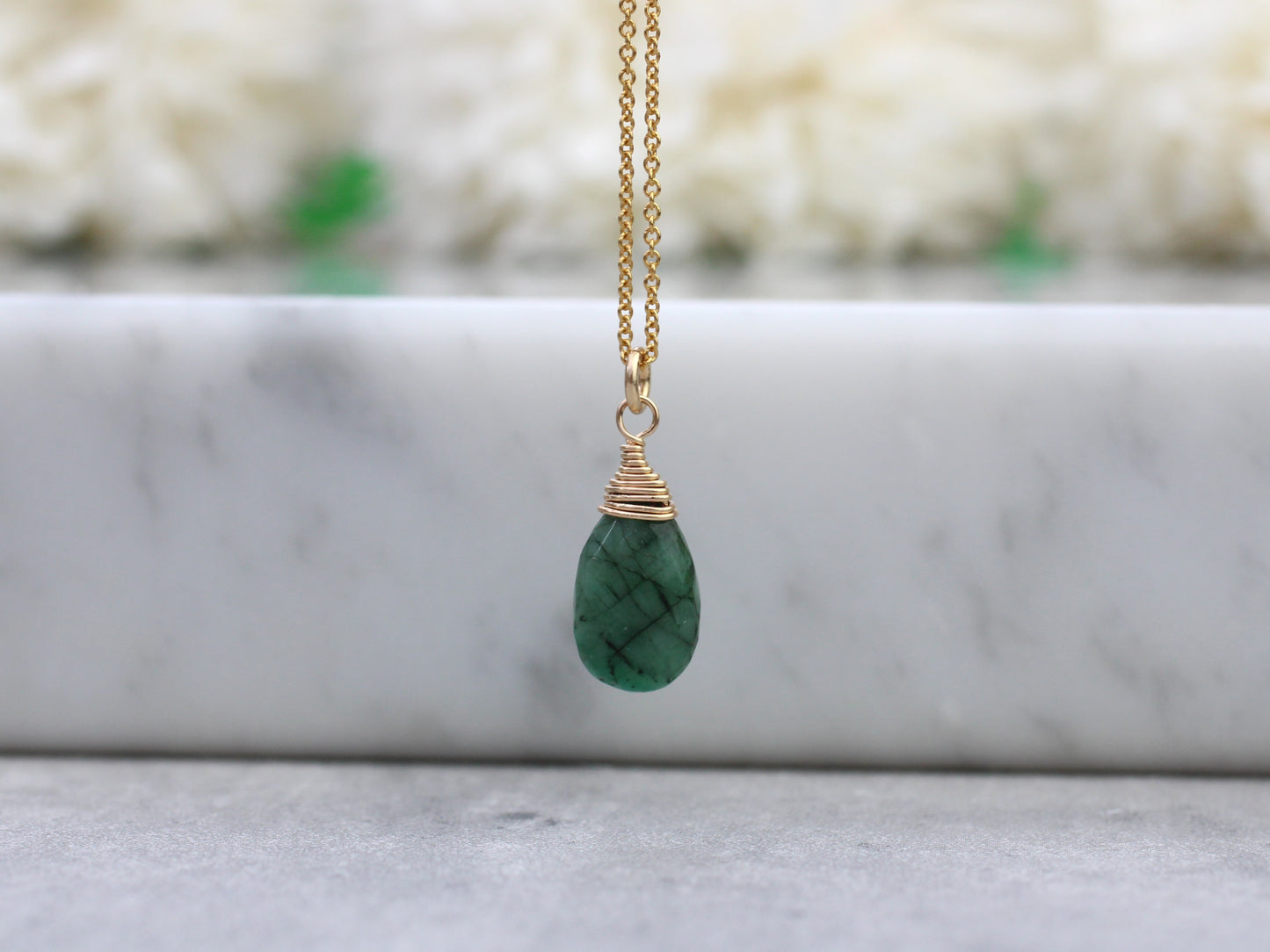 Emerald necklace in silver or gold.