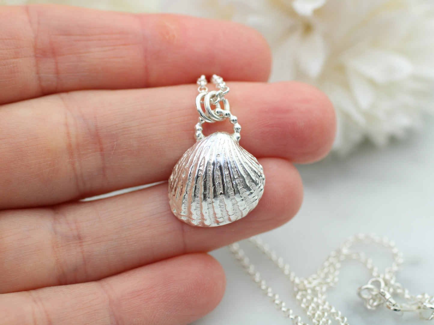 Seashell pendant necklace with optional freshwater pearl.