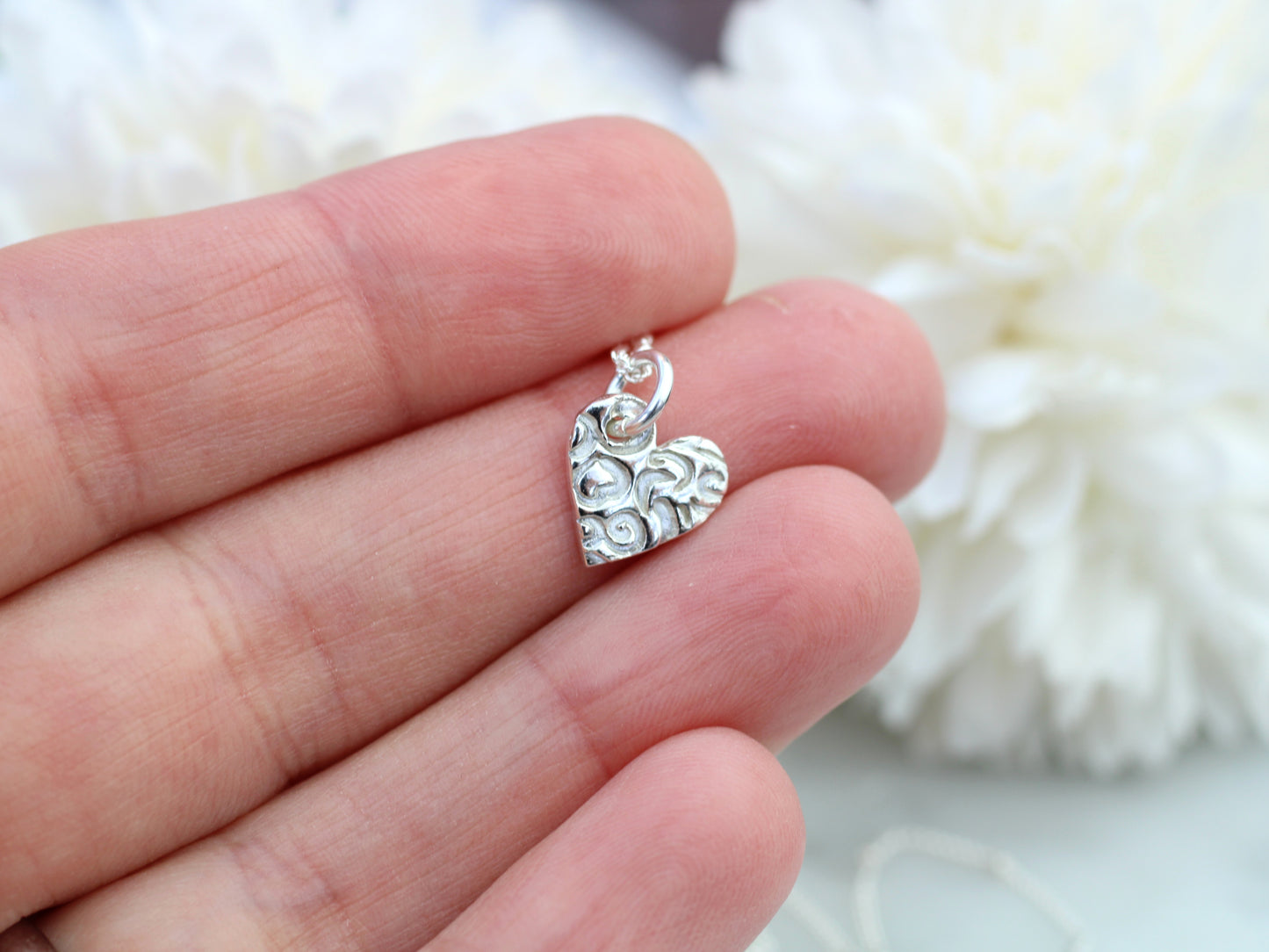 Pure silver heart pendant necklace.