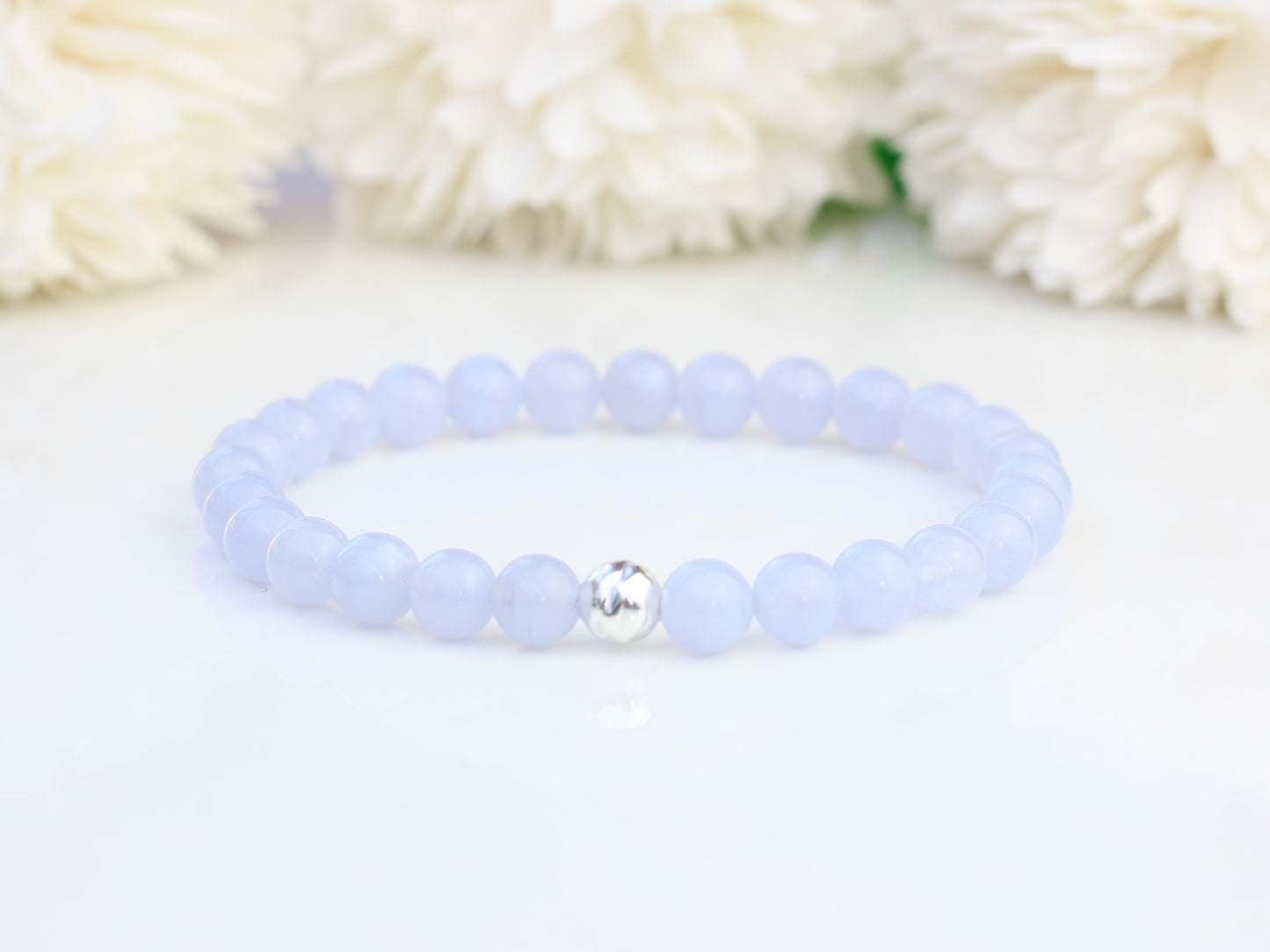Blue lace agate stretch bracelet with sterling silver accent bead.