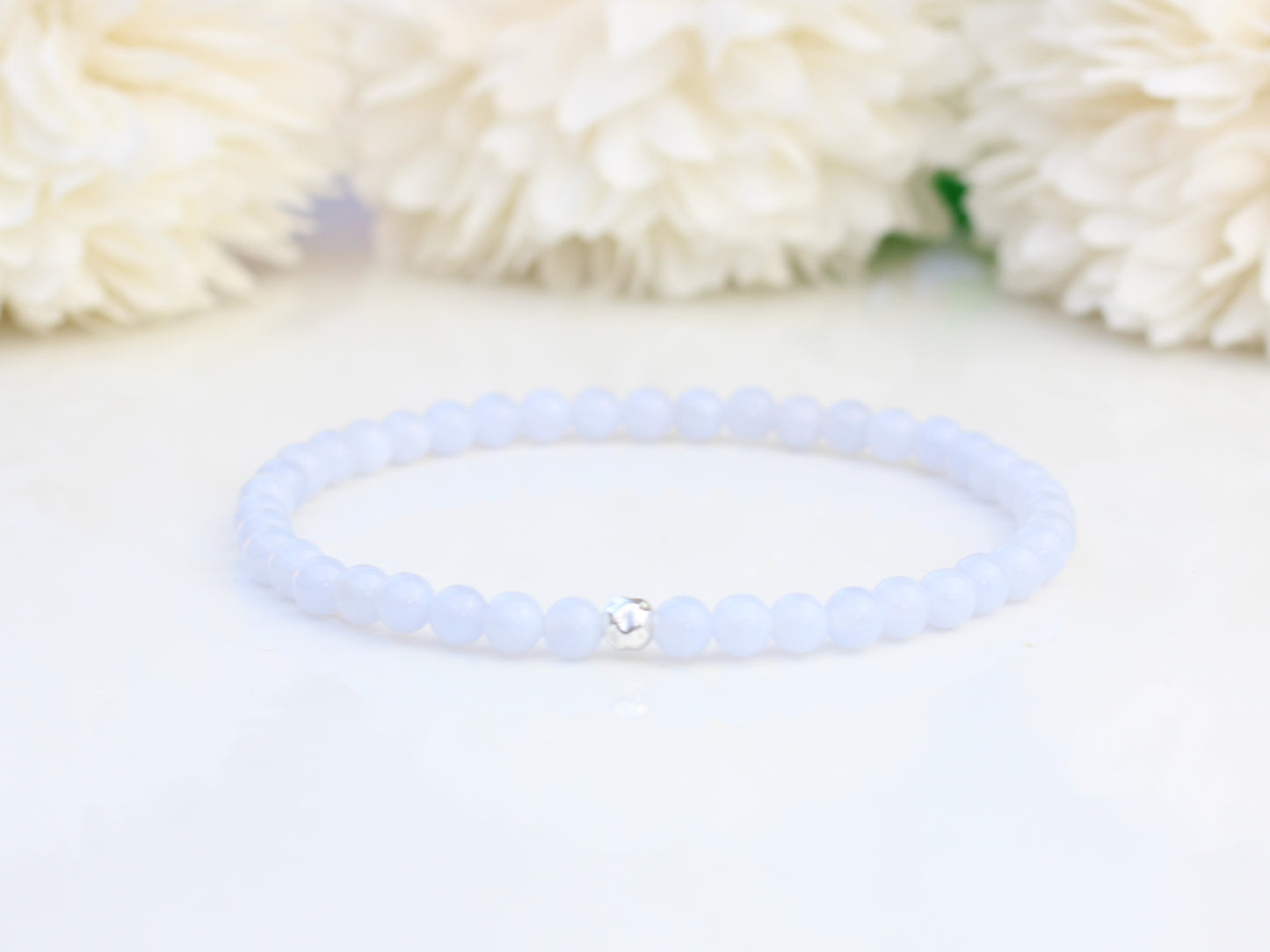 Blue lace agate stretch bracelet with sterling silver accent bead.