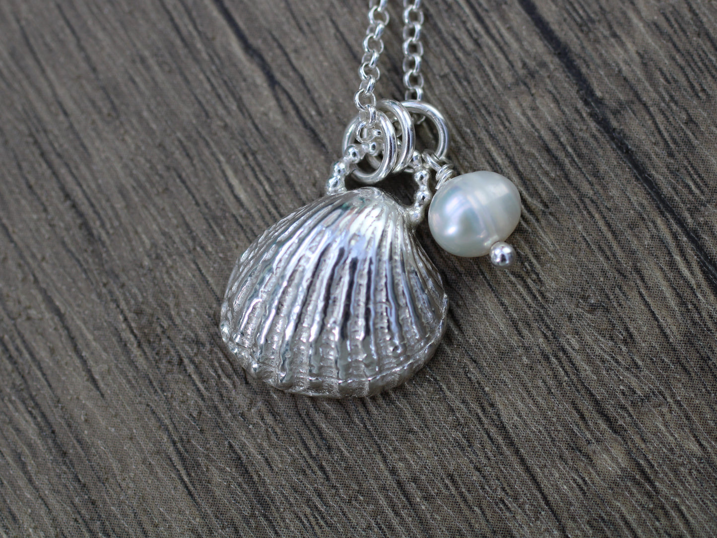 Seashell pendant necklace with optional freshwater pearl.