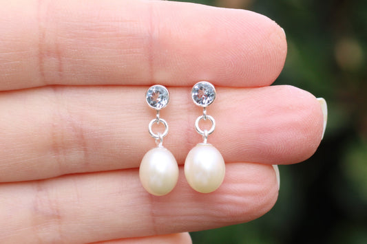Blue topaz and pearl drop earrings.