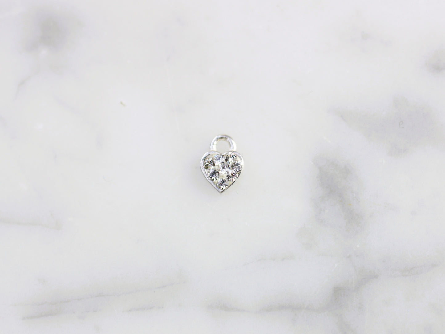White crystal heart charm.