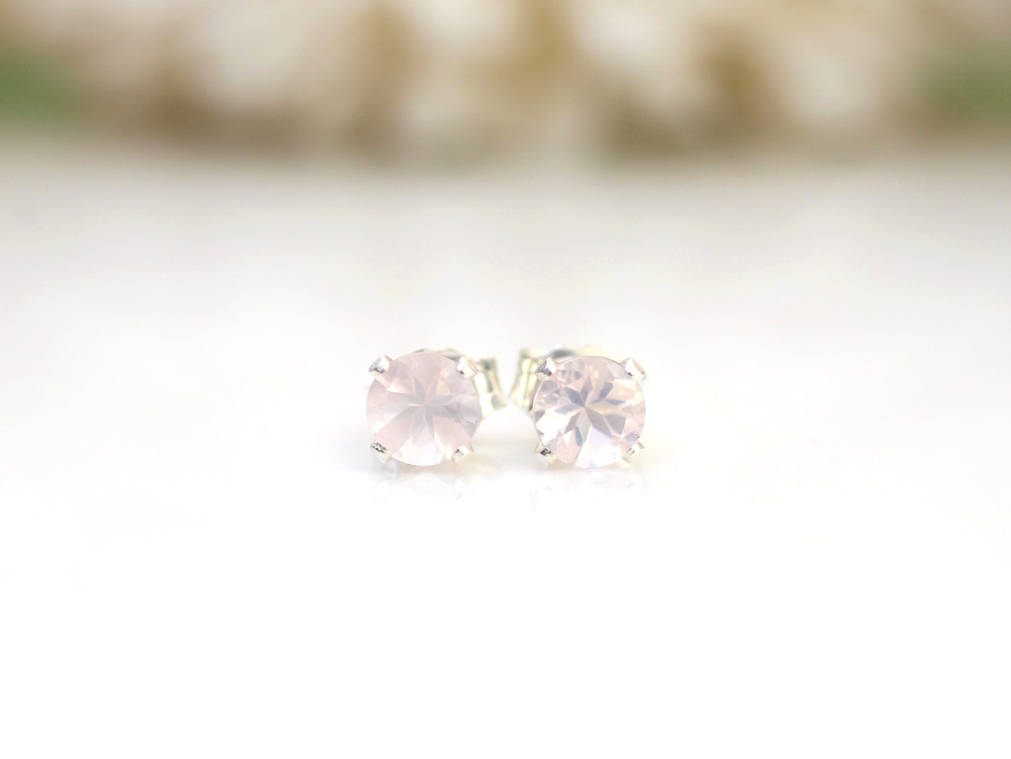 Rose quartz stud earrings in silver or gold.