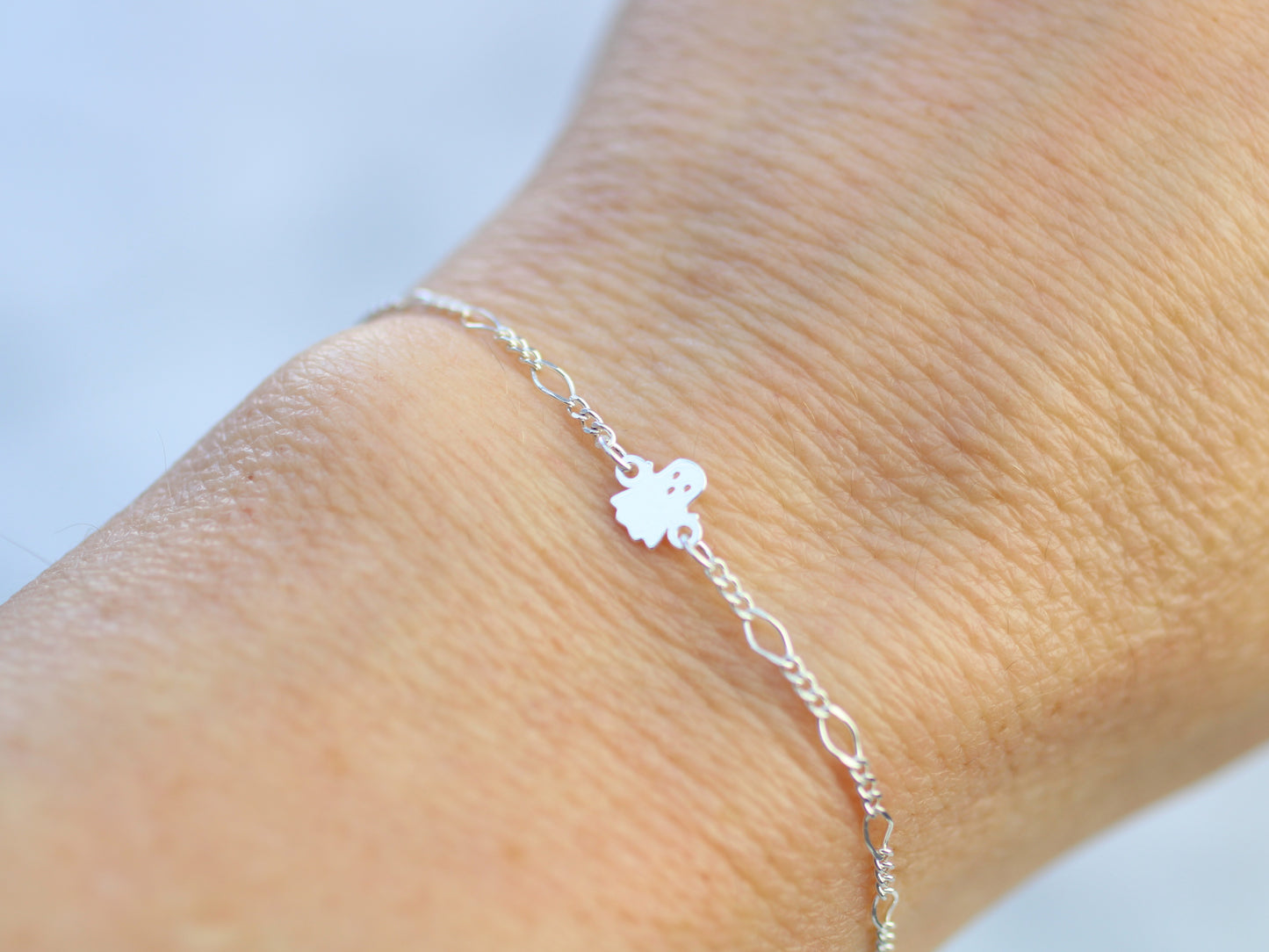 Dainty ghost bracelet in silver or gold.