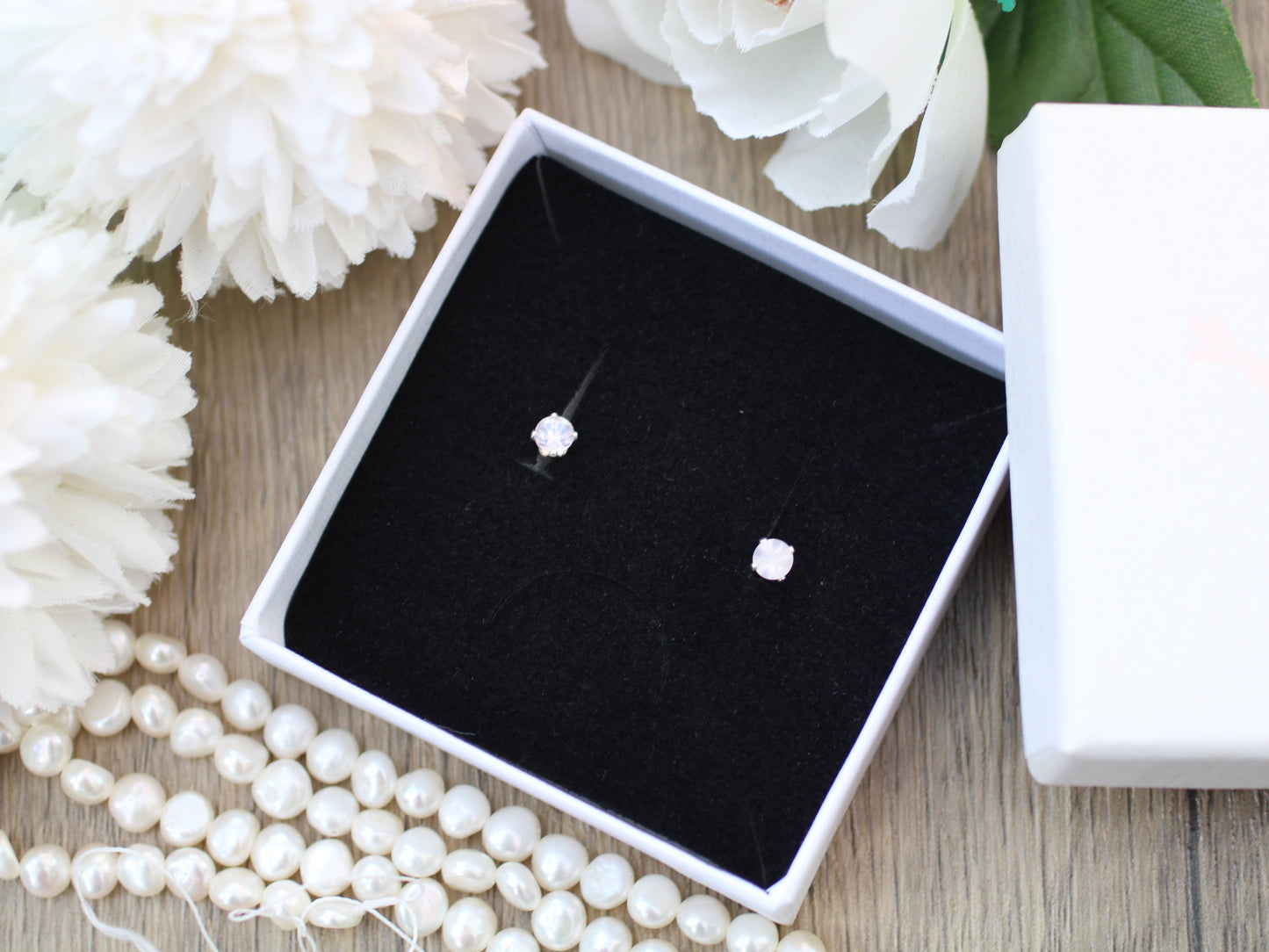 Rose quartz stud earrings in silver or gold.