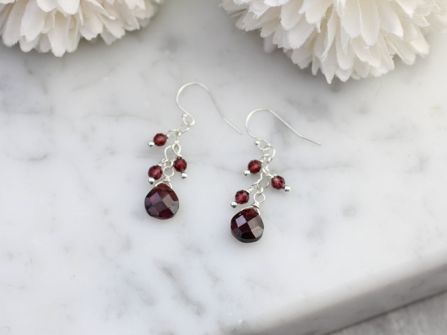 Garnet cluster earrings in sterling silver.