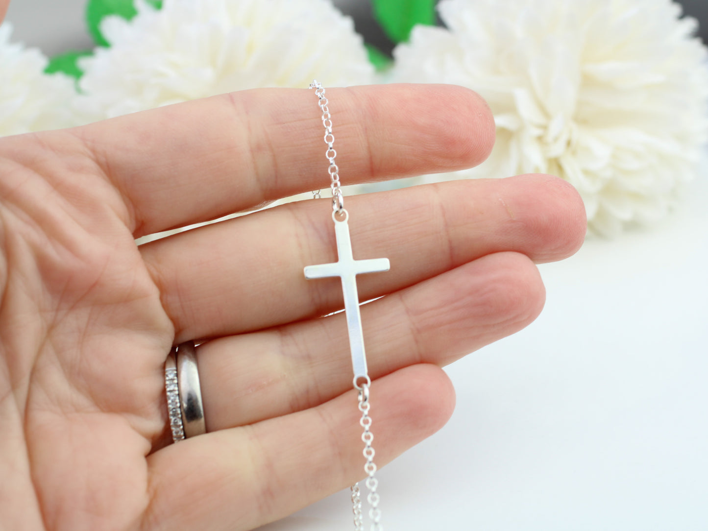 Sideways cross bracelet in sterling silver, adjustable.