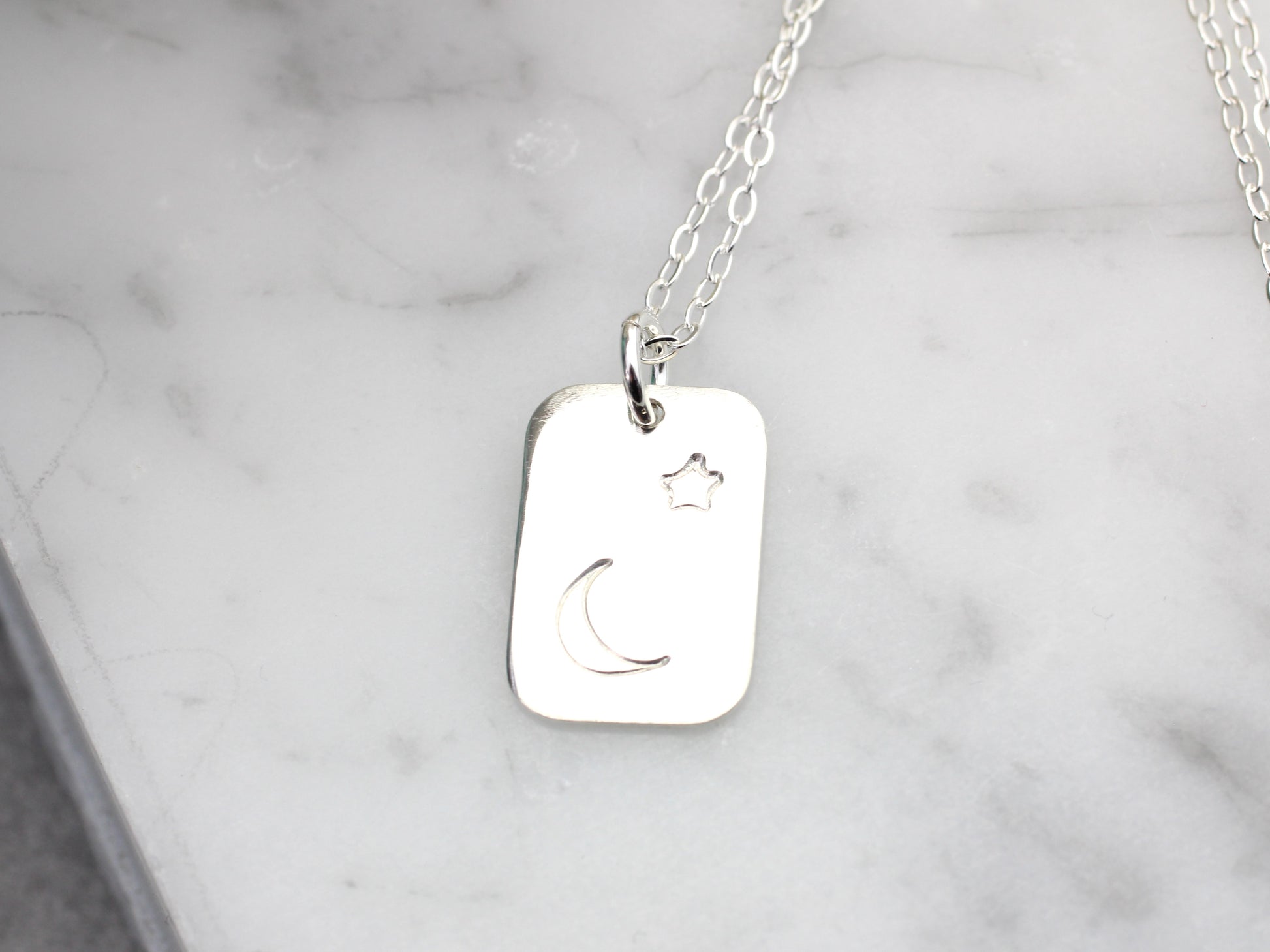 celestial necklace with moon and stars