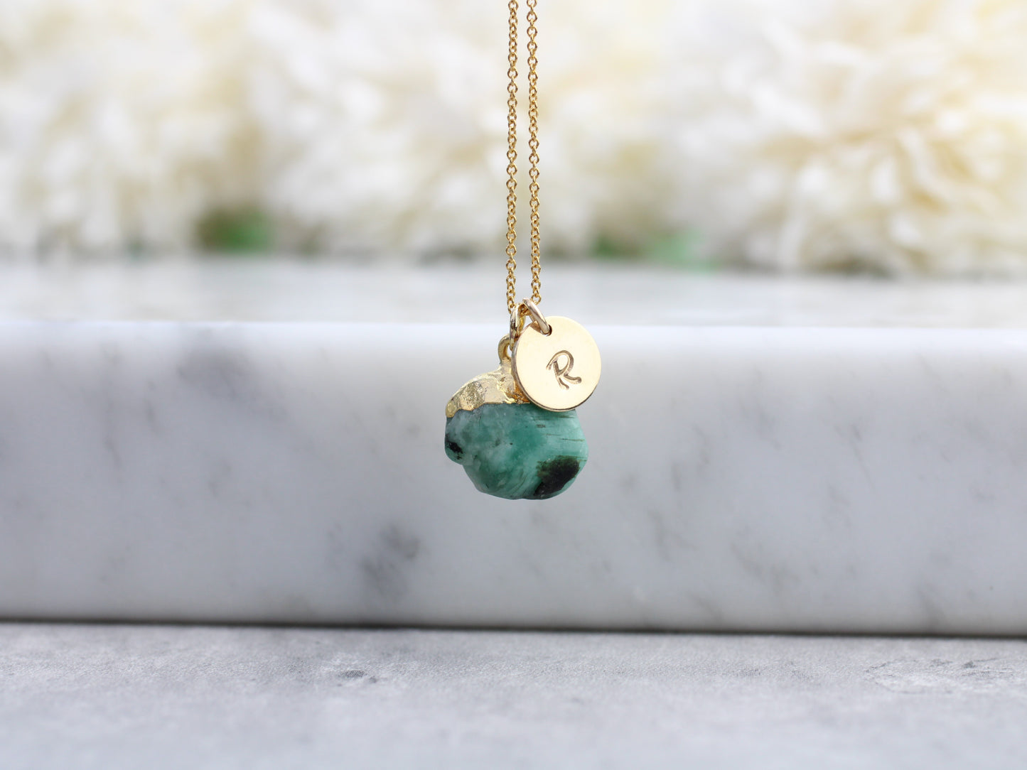 Personalised emerald necklace in gold.