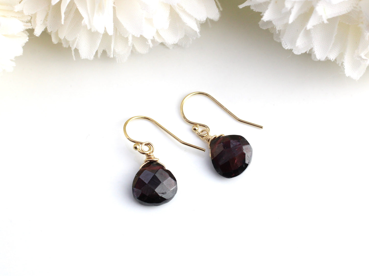 Garnet earrings in sterling silver or gold.