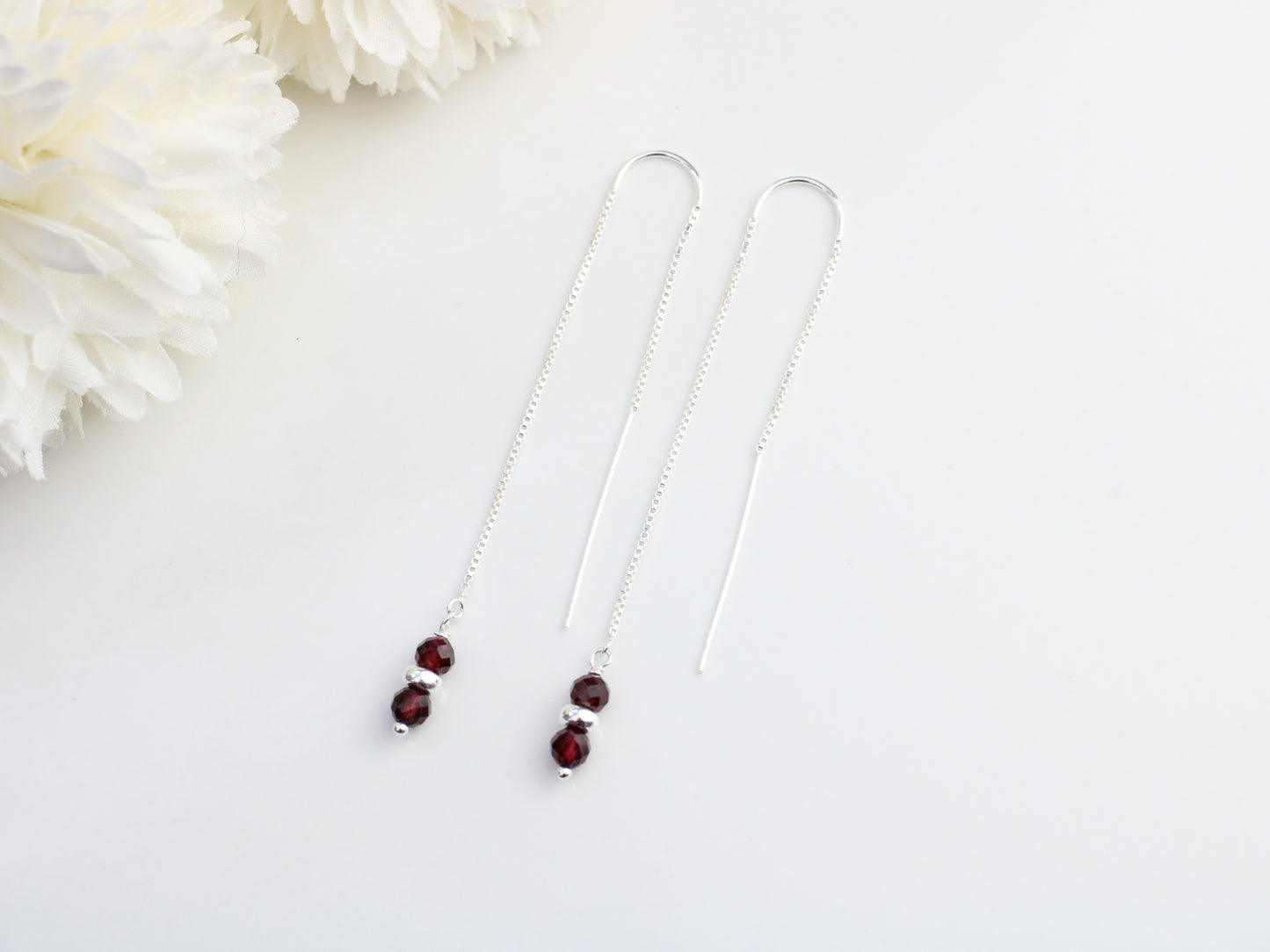 Garnet thread through earrings in sterling silver.