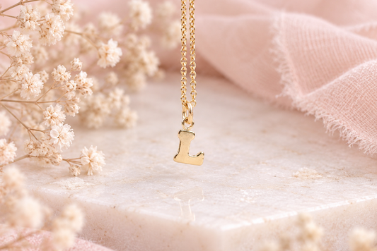 Dainty gold initial necklace.