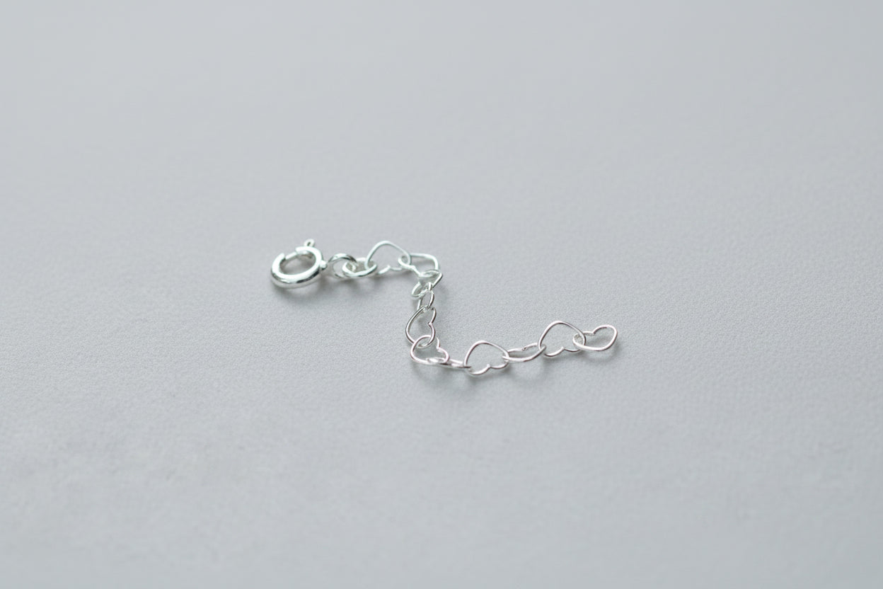 Silver chain on a pink textured background