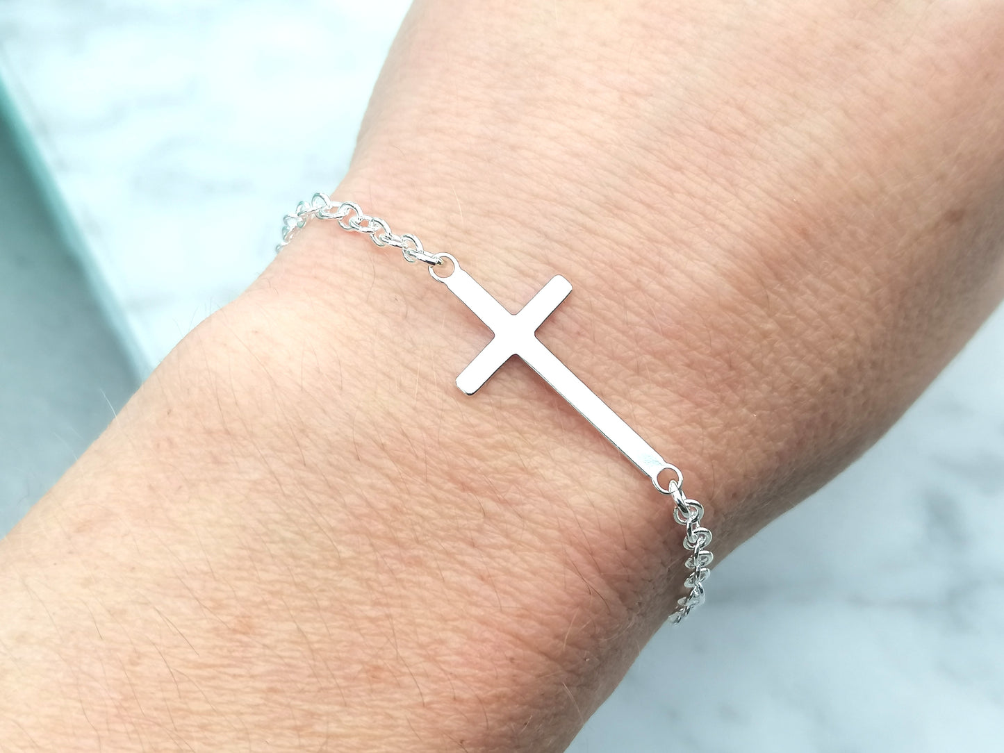 Sideways cross bracelet in sterling silver, adjustable.