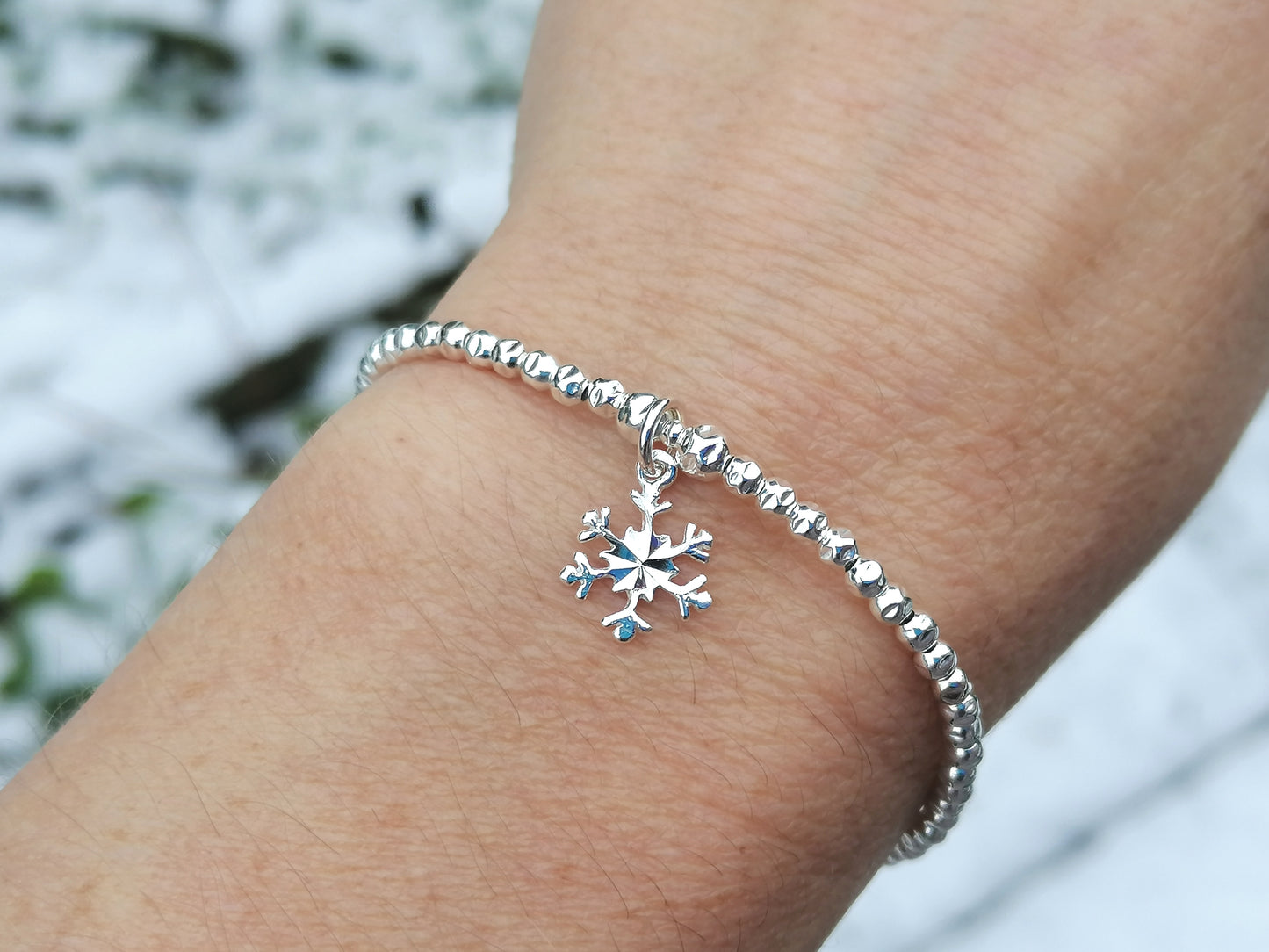 Snowflake charm bracelet.