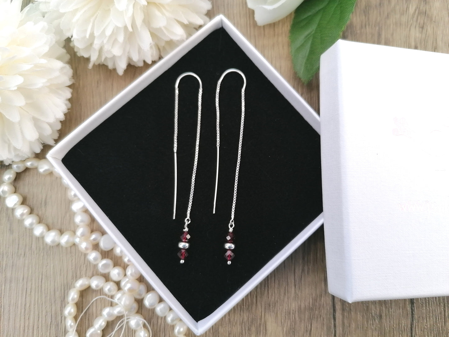 Garnet thread through earrings in sterling silver.