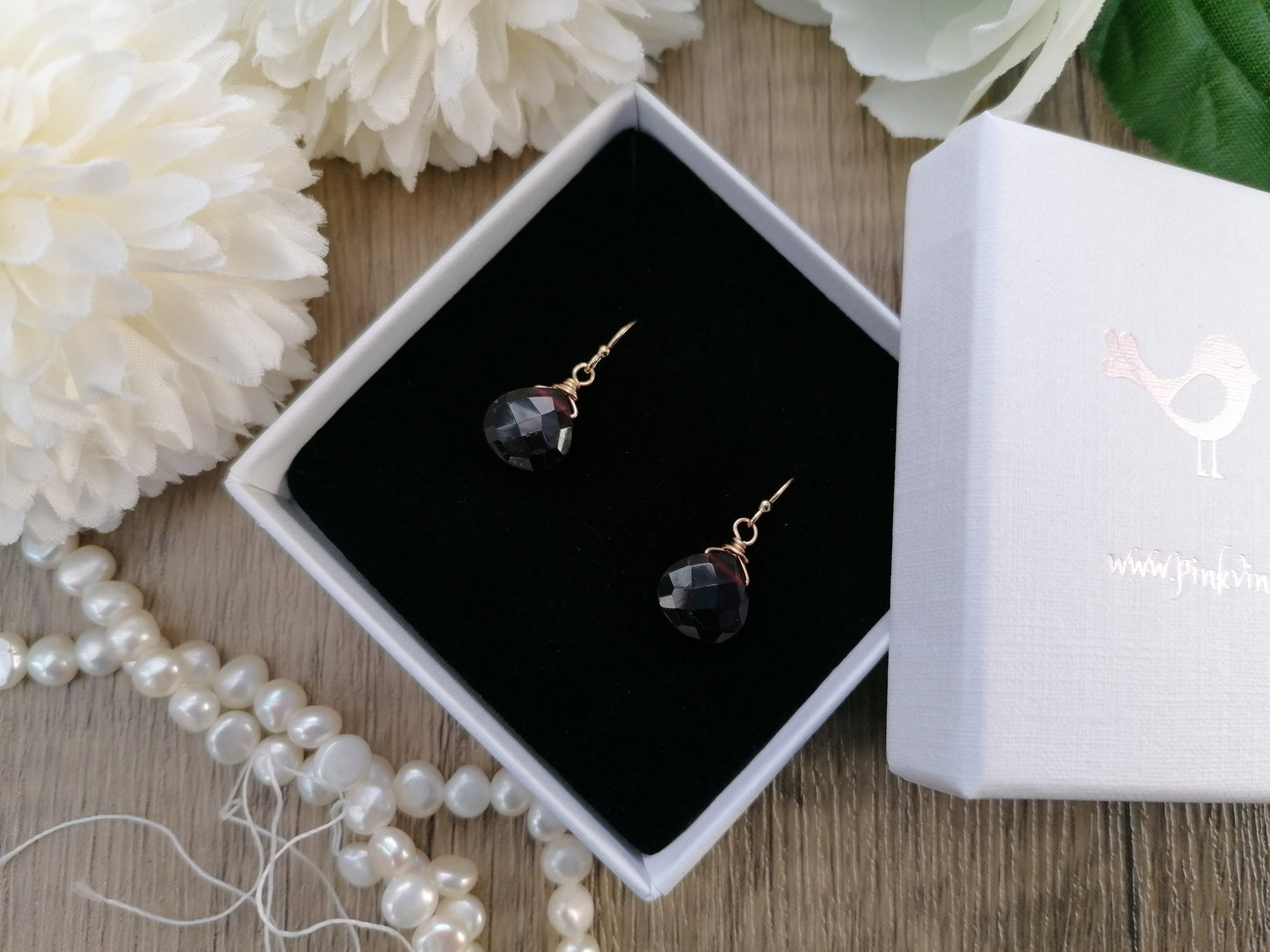 Garnet earrings in sterling silver or gold.