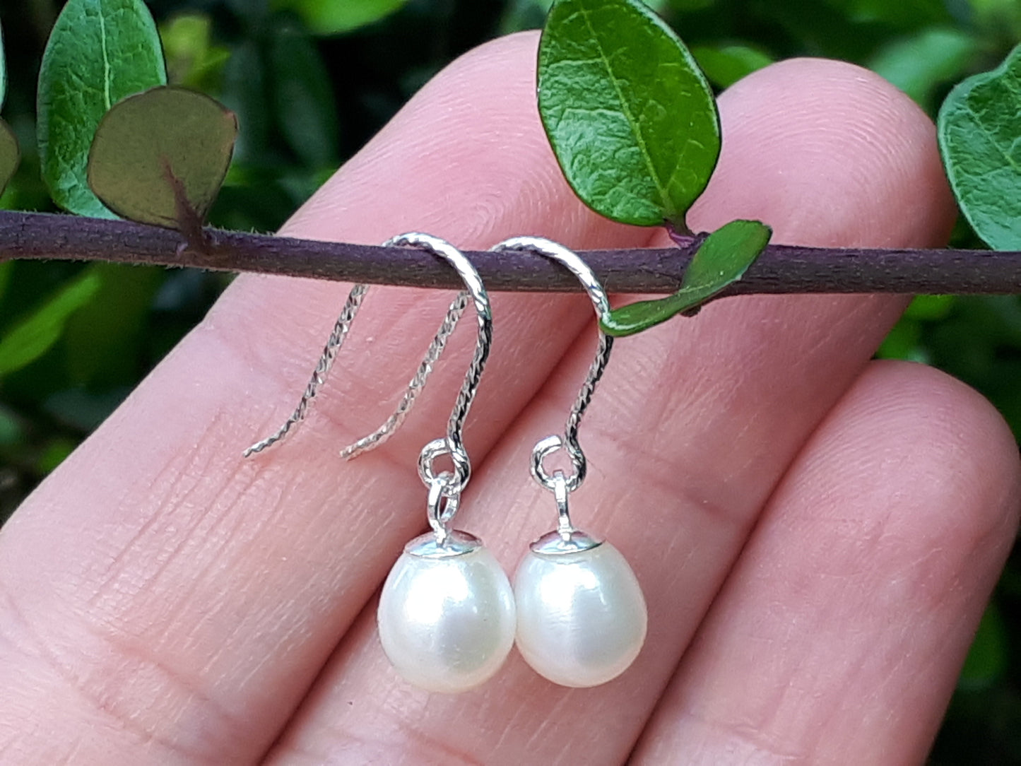 Silver and pearl drop earrings.