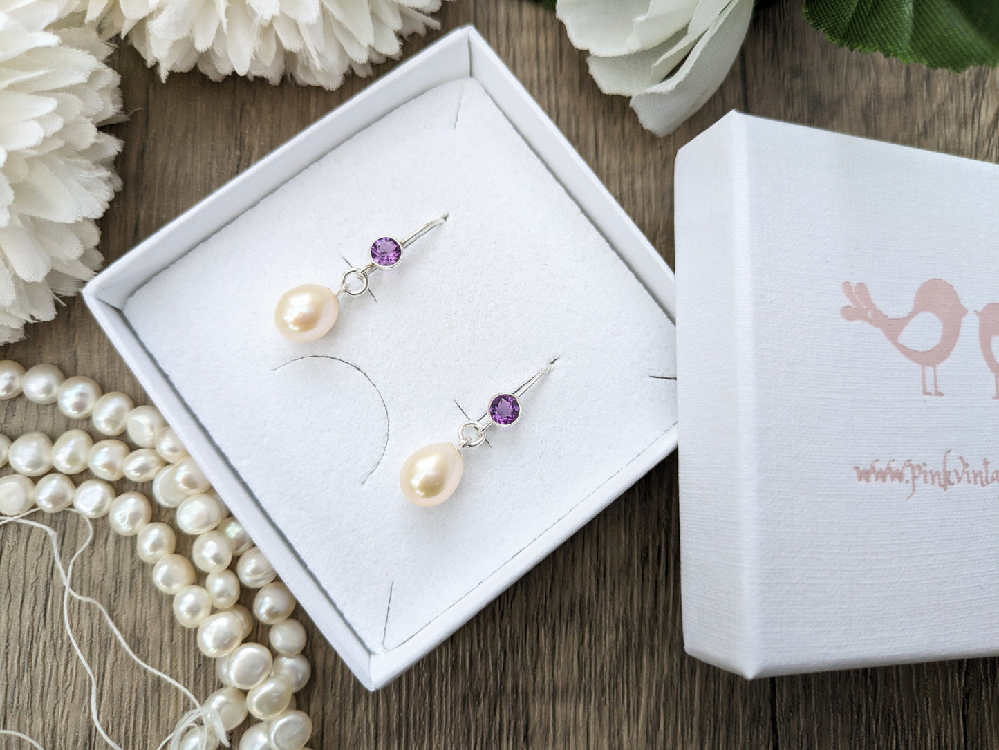 Amethyst and pearl drop earrings.