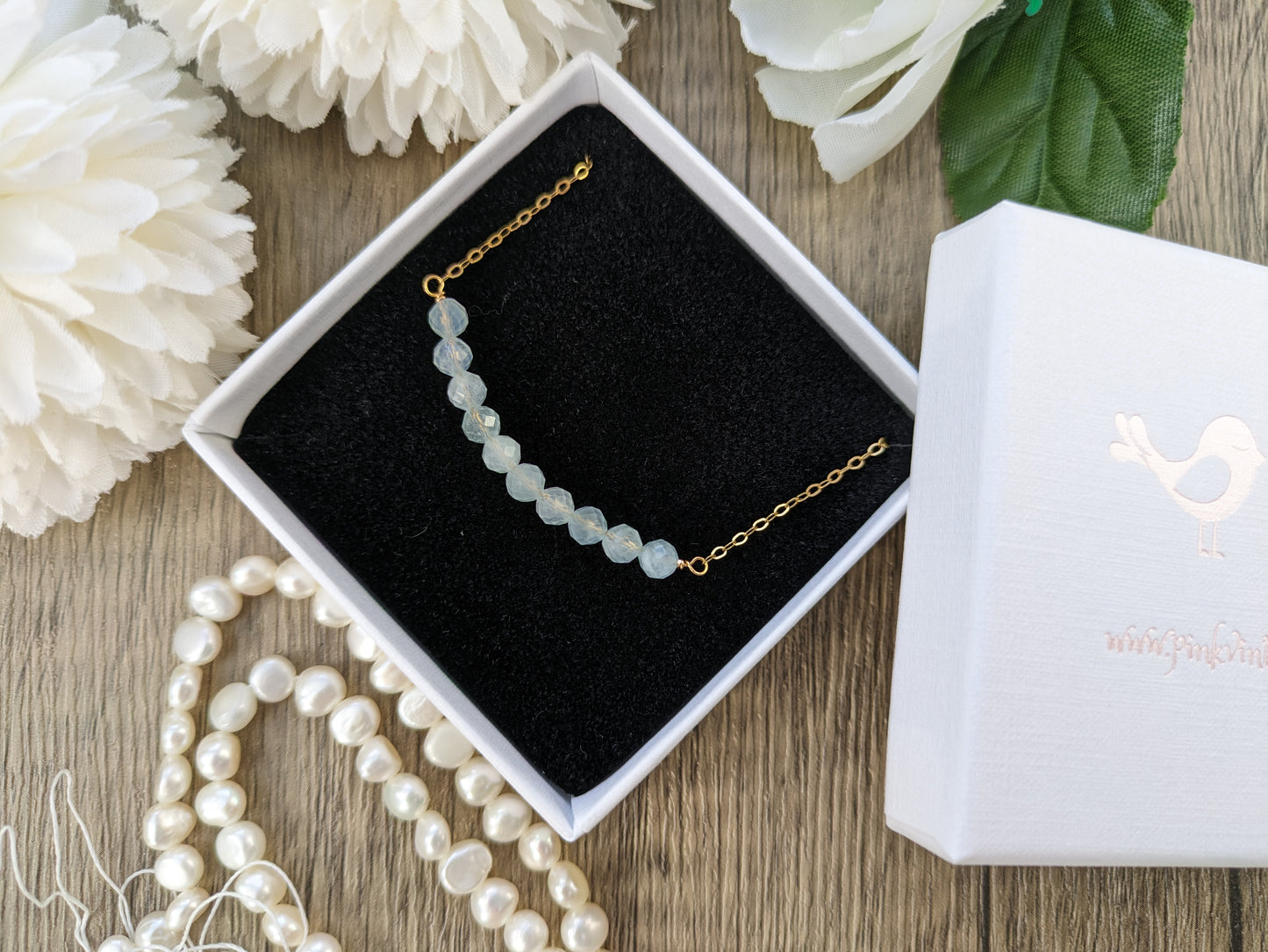 Aquamarine birthstone necklace in silver or gold.