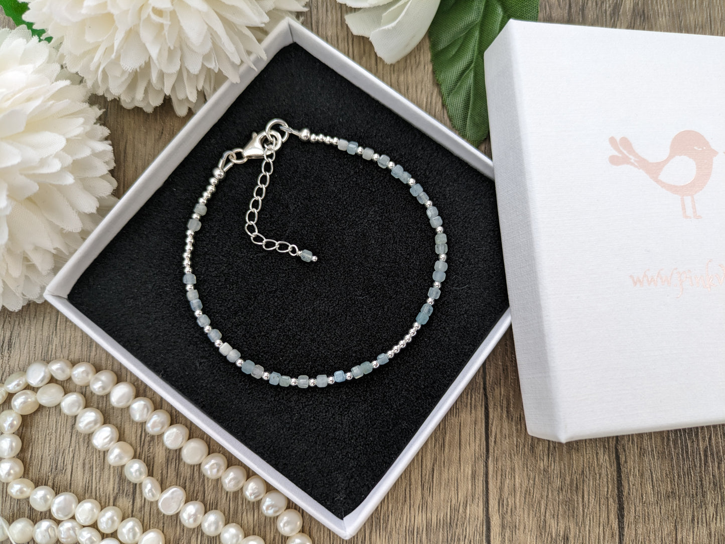 I love you morse code bracelet with aquamarine gemstones.
