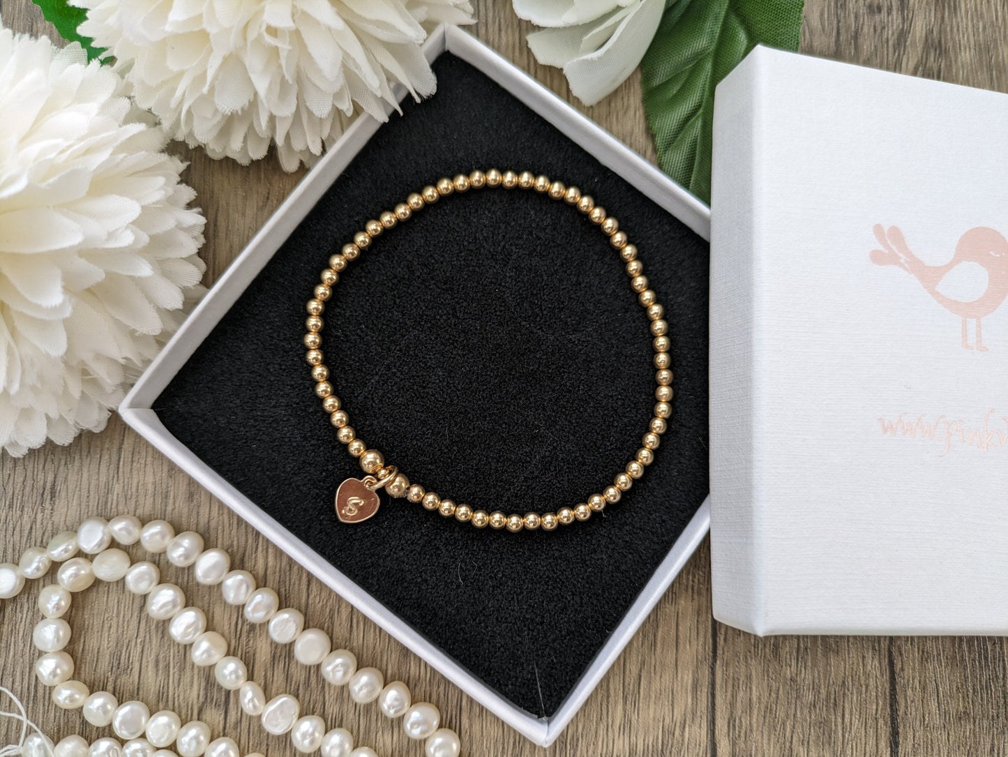 Personalised gold stretch bracelet.