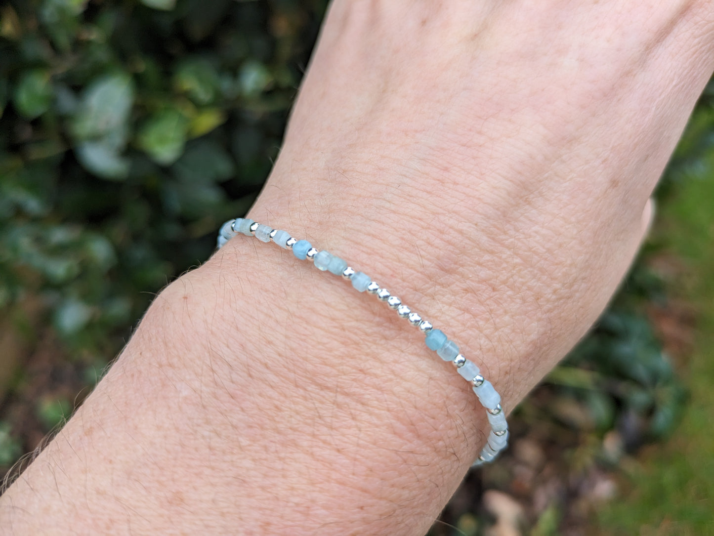 I love you morse code bracelet with aquamarine gemstones.