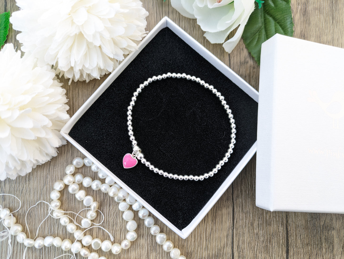 Pink heart charm bead bracelet.