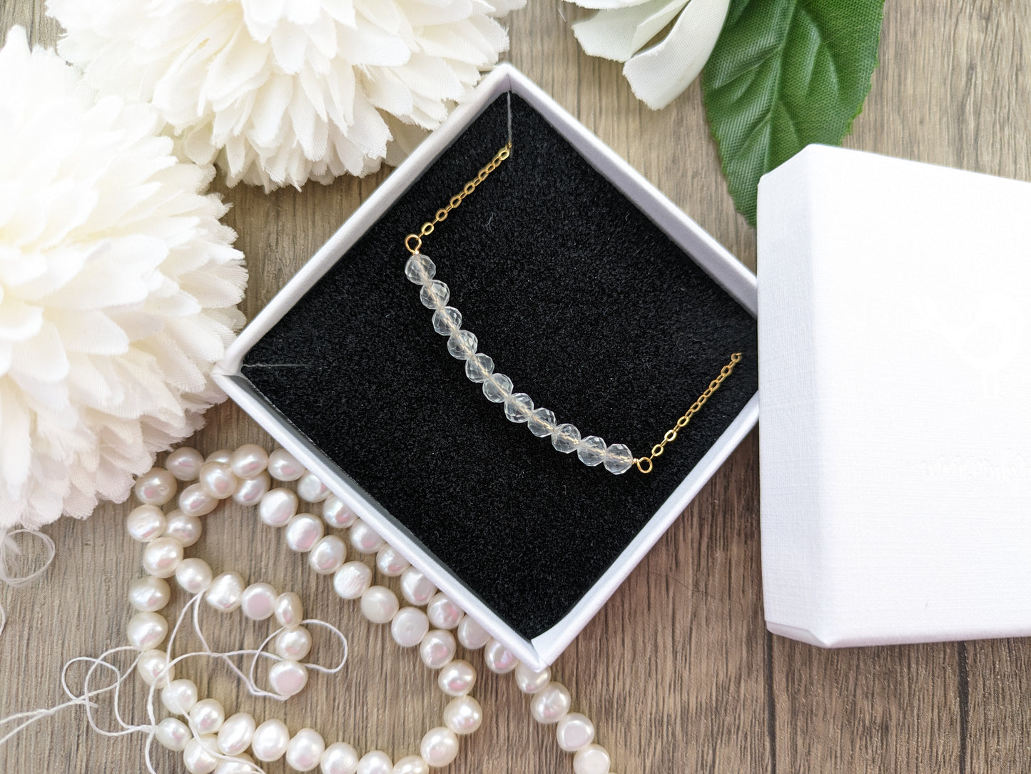Quartz gemstone necklace in silver or gold.