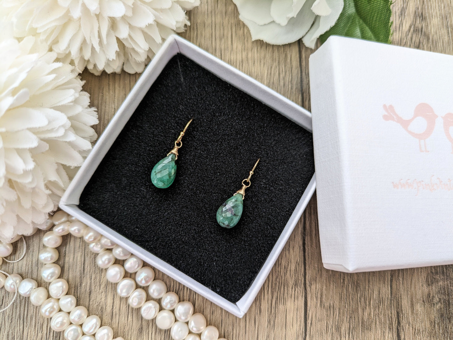 May birthstone earrings.