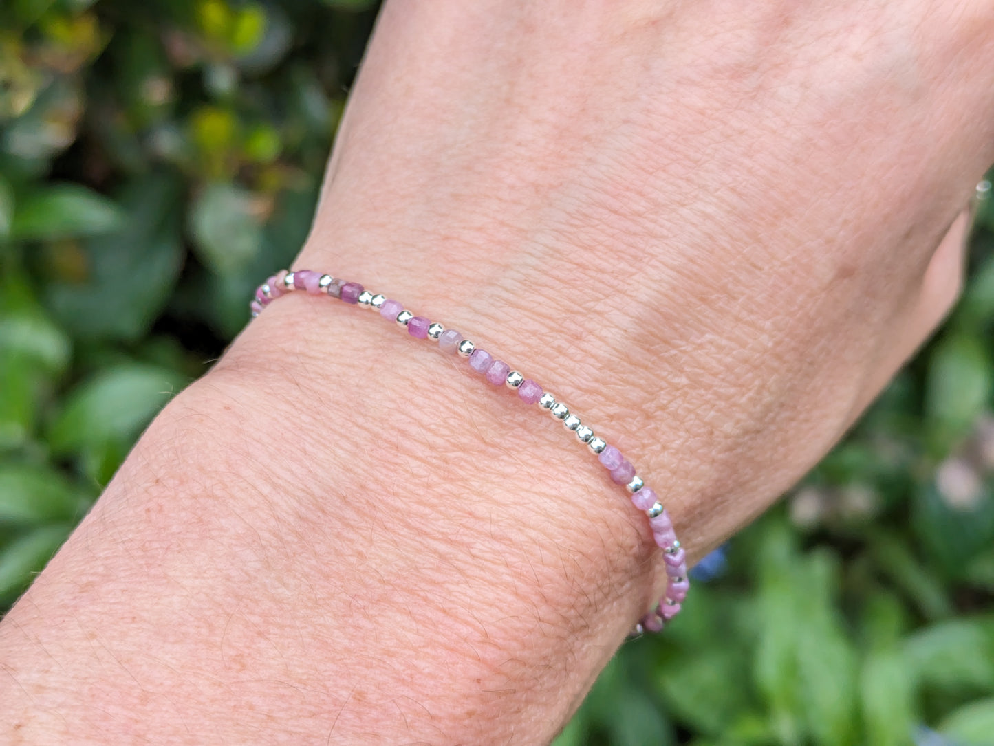 I love you morse code bracelet with ruby gemstones.