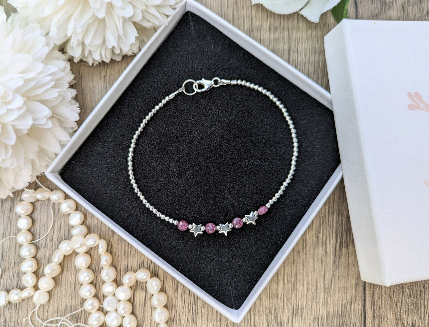 Star bracelet with ruby gemstones. July birthstone.