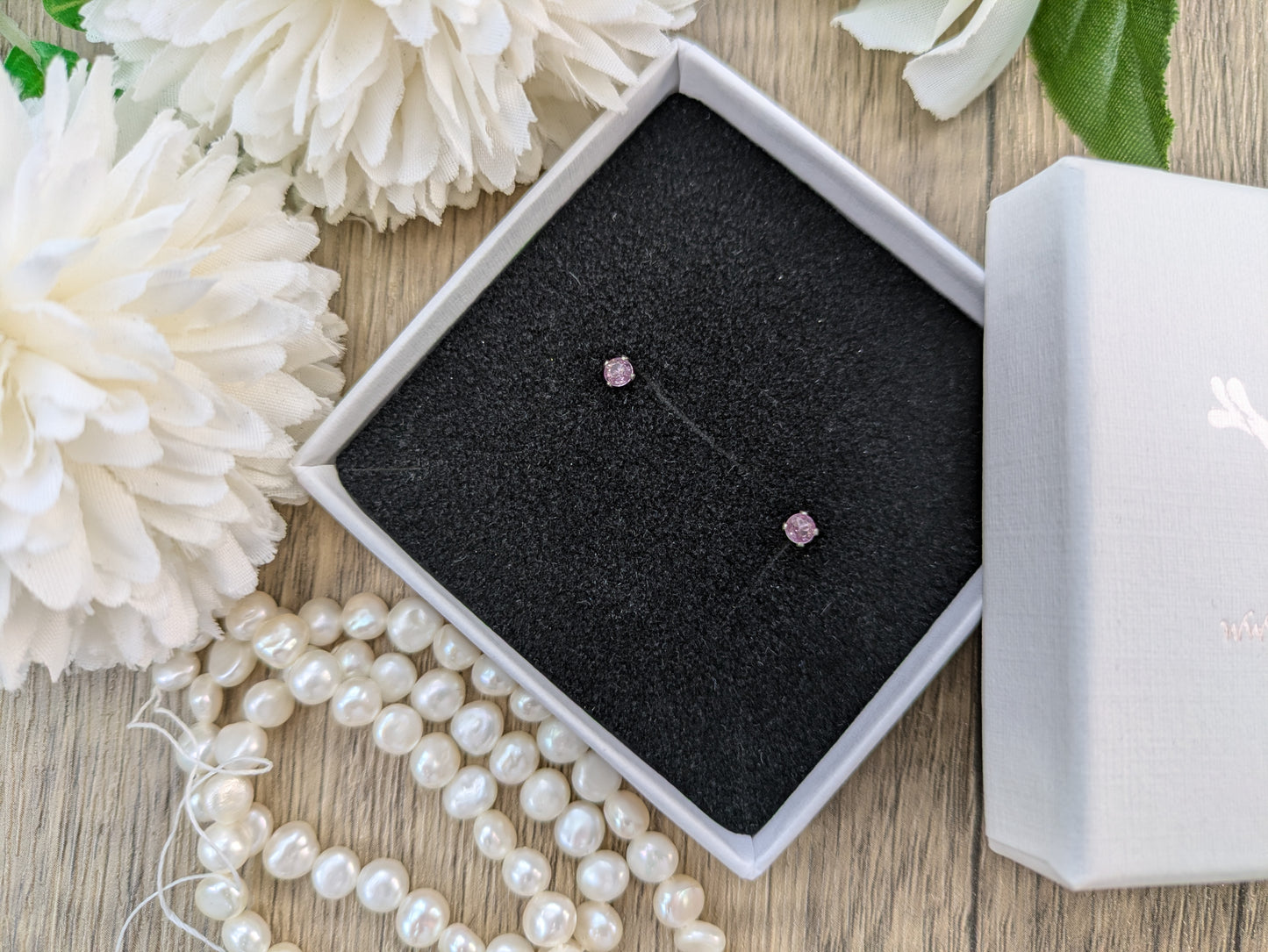 Pink sapphire stud earrings in silver or gold.