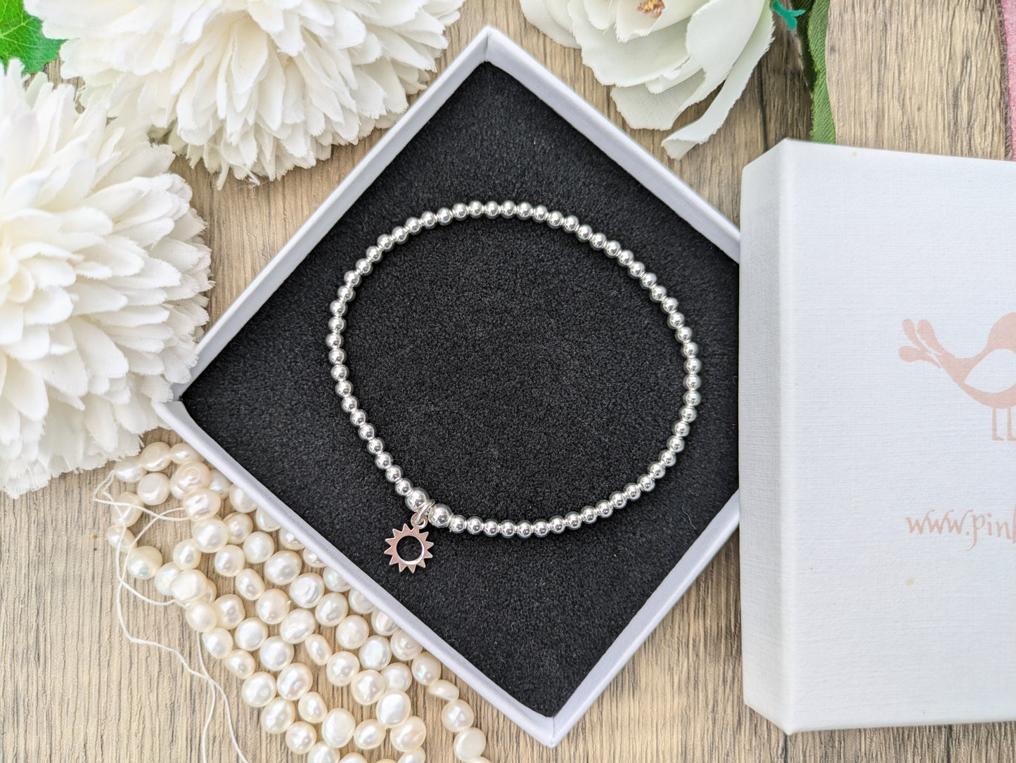 Sun charm bracelet.