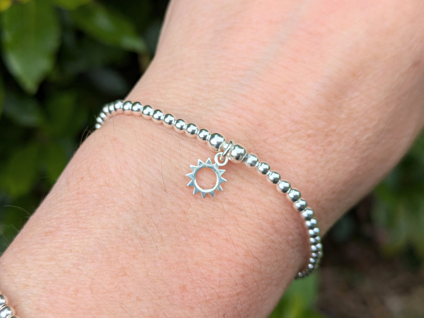 Sun charm bracelet.