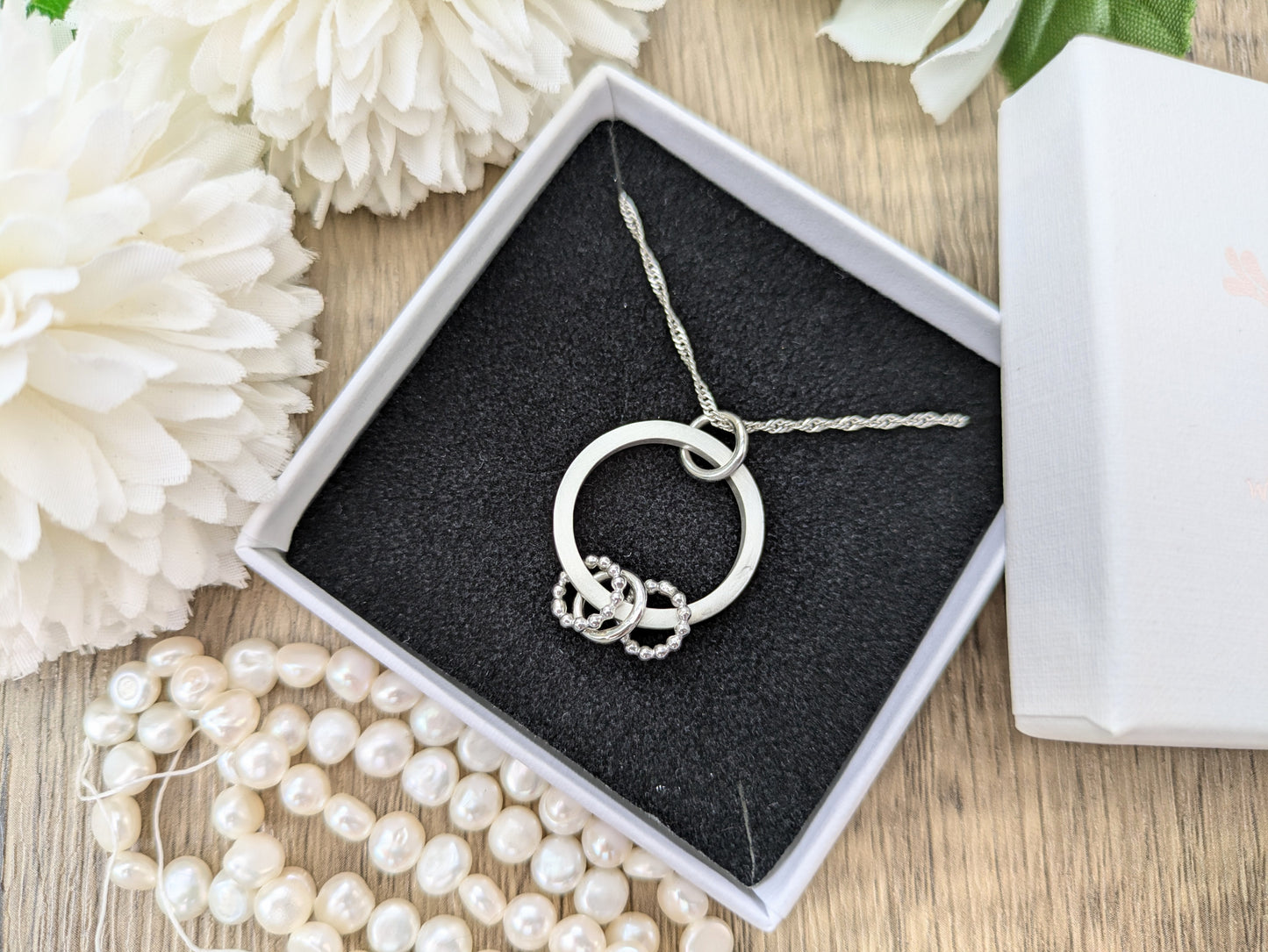30th birthday necklace with 3 rings.