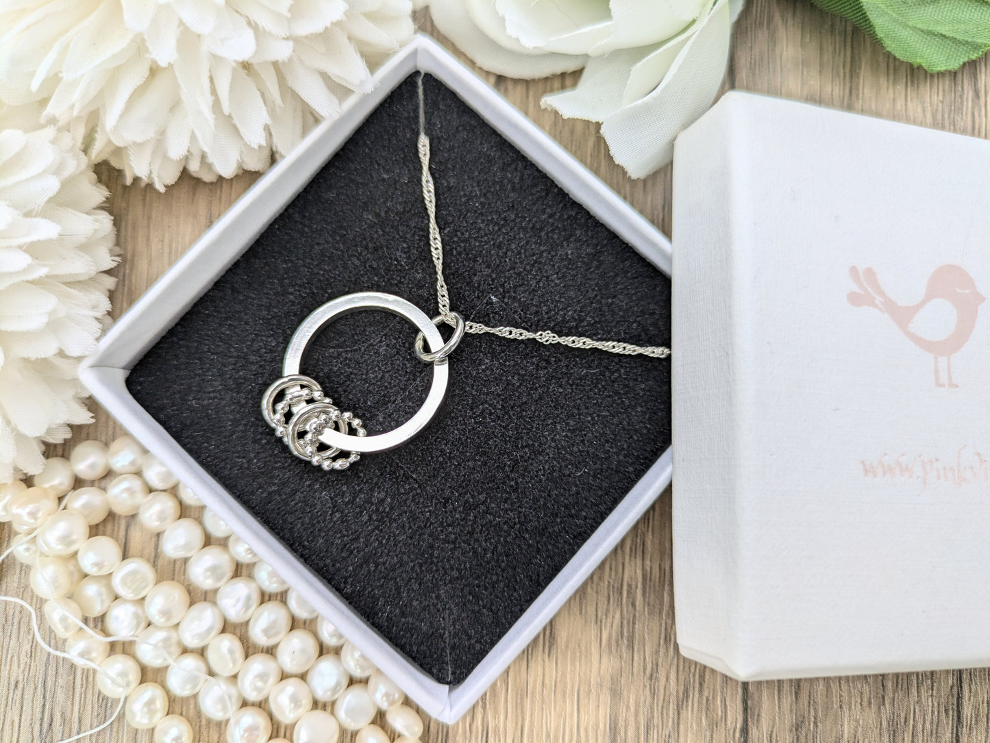40th birthday necklace with 4 rings.