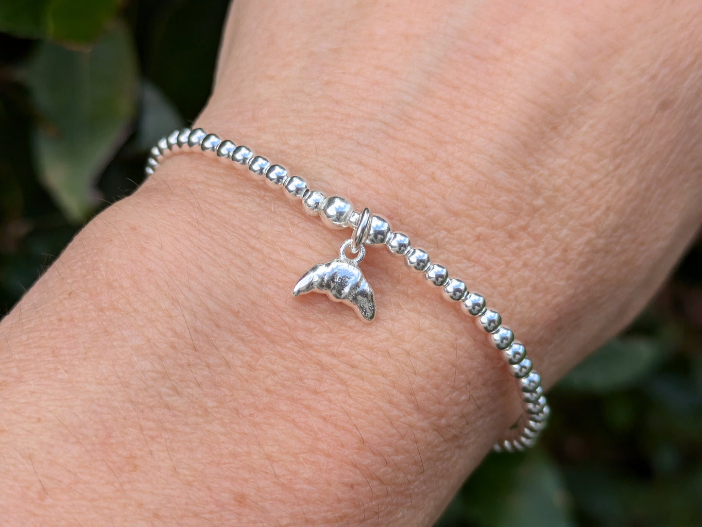 Croissant charm bracelet.