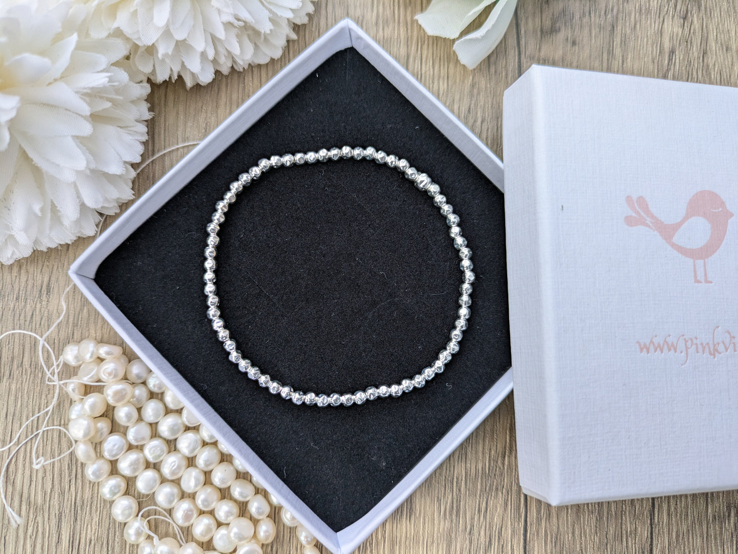 Silver bead bracelet.