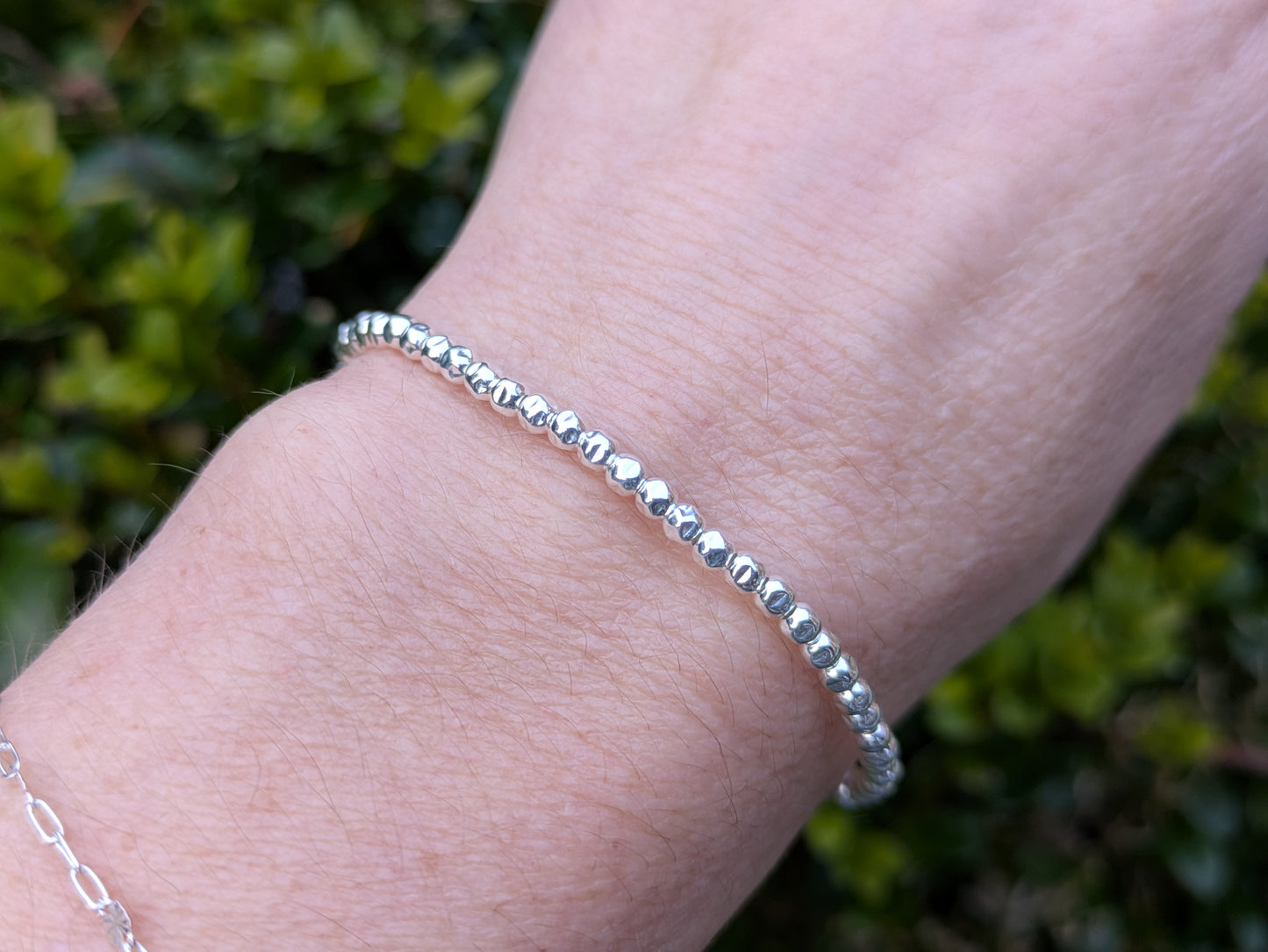 Silver bead bracelet.