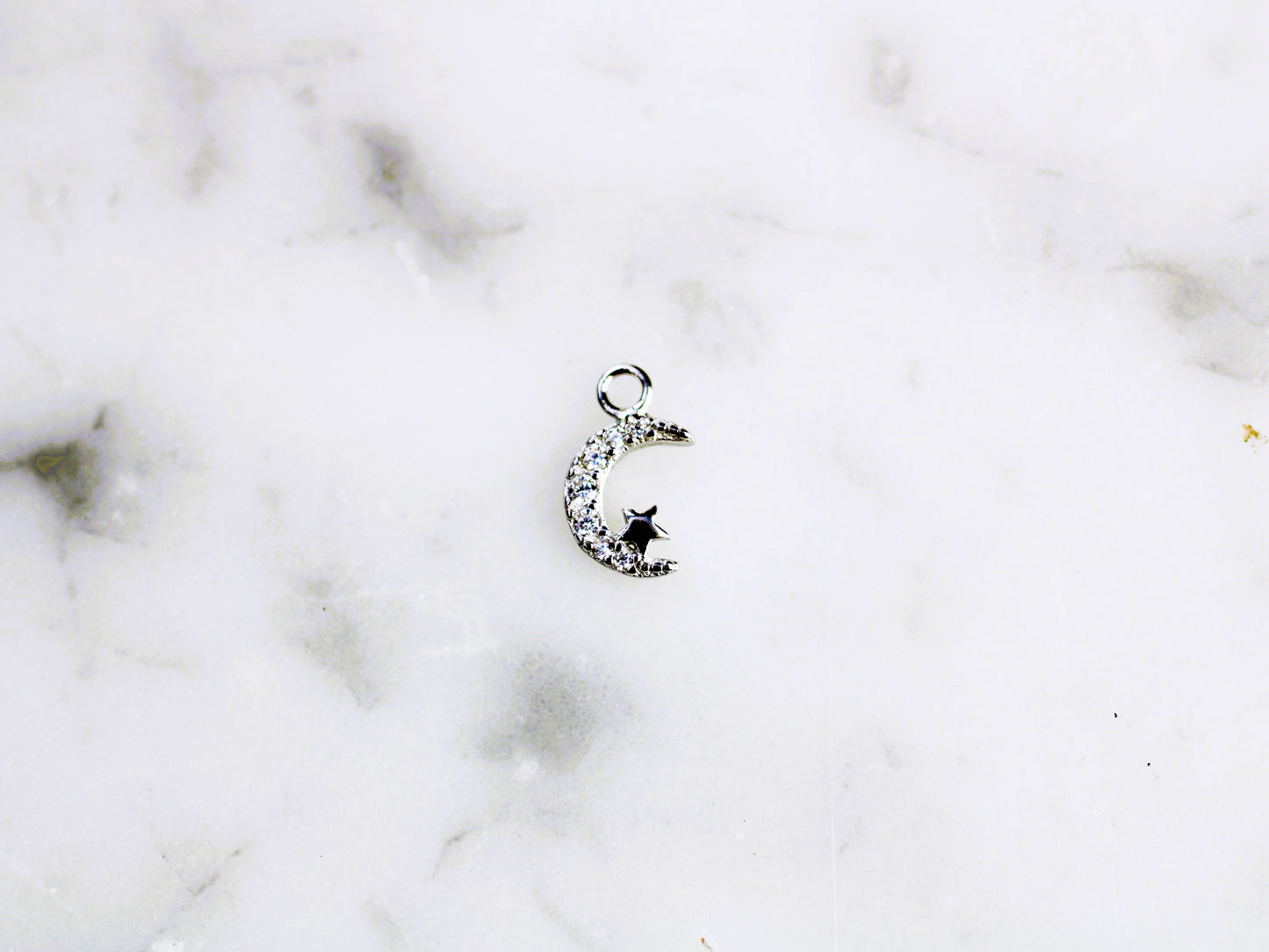 Sparkly moon and star charm.