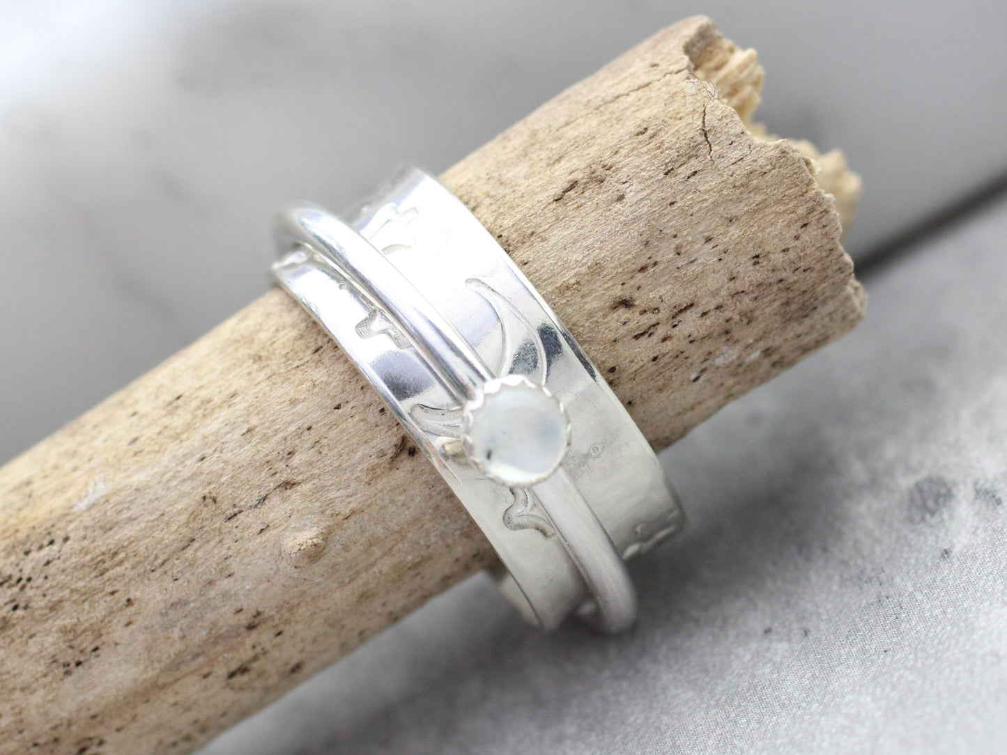 Celestial spinner ring in sterling silver with moonstone gemstone.