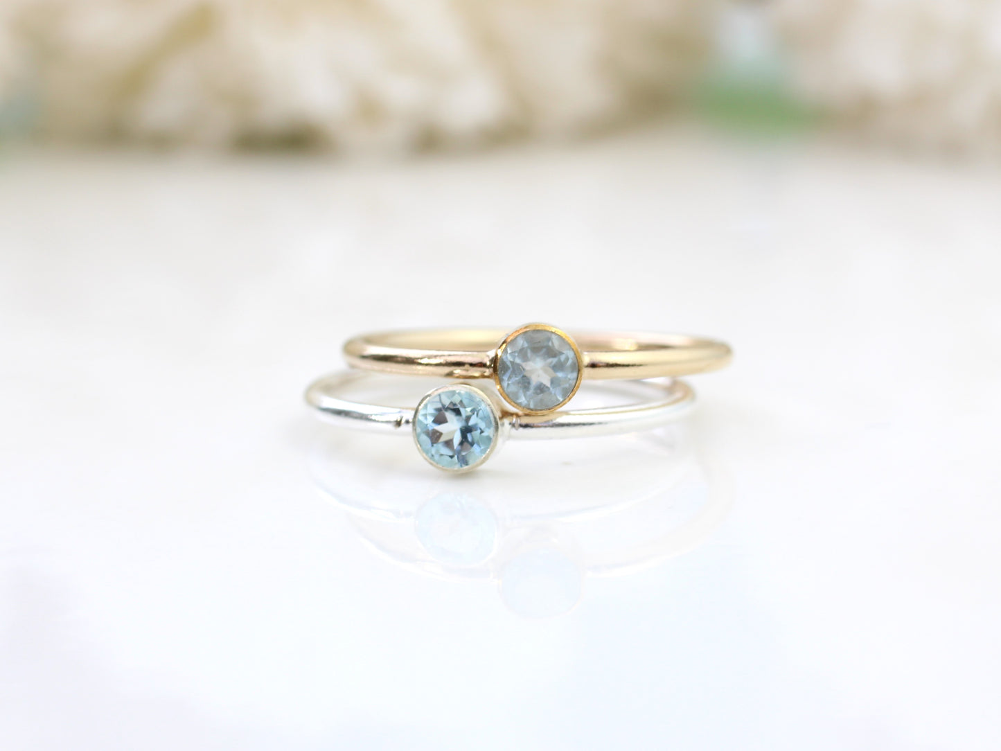 Aquamarine birthstone ring in silver or gold.