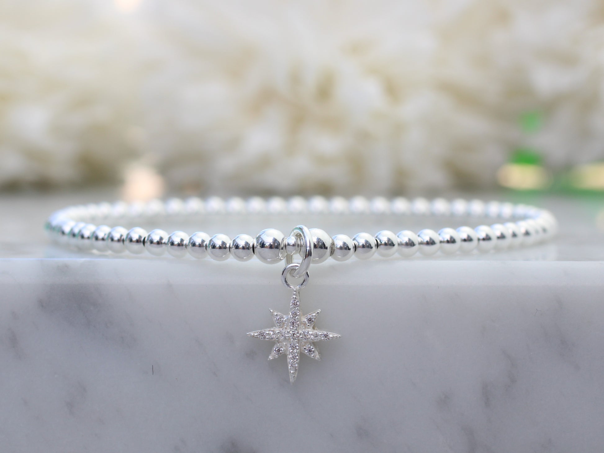 beaded bracelet with north star charm