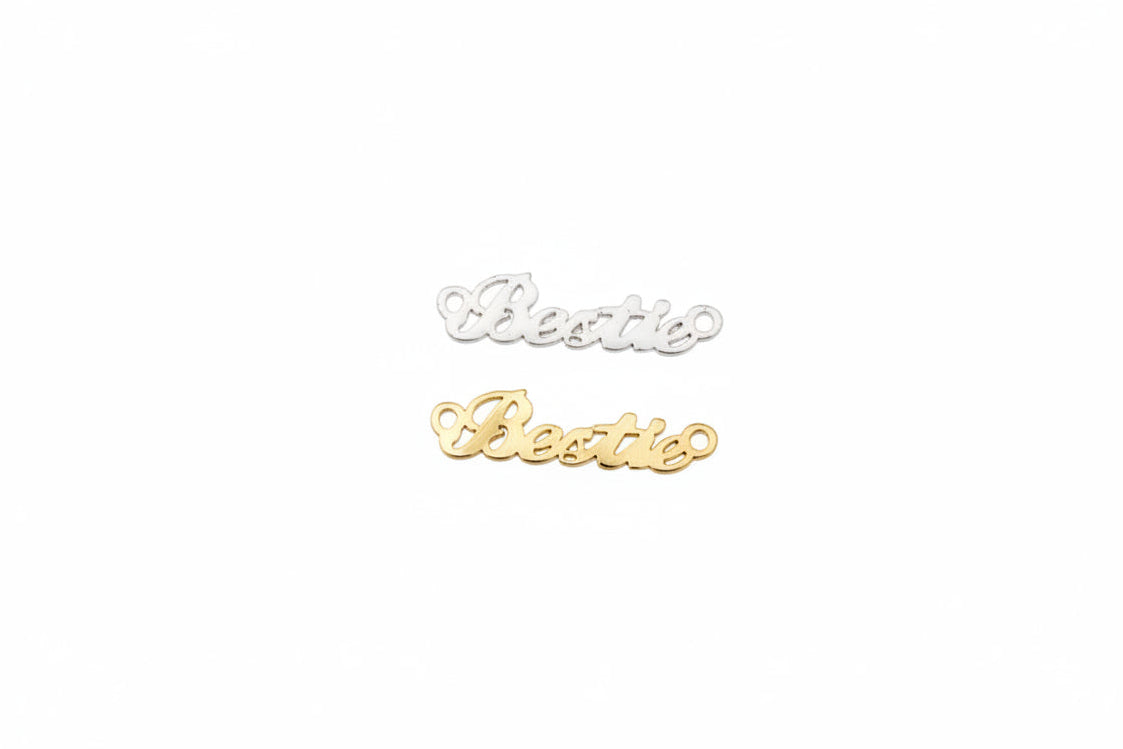 Two gold 'Beastie' nameplates on a light gray background