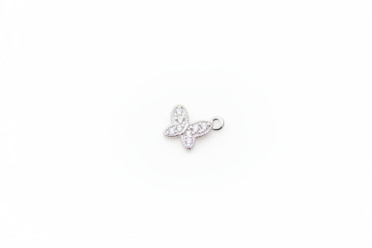 Silver butterfly charm on a light gray background