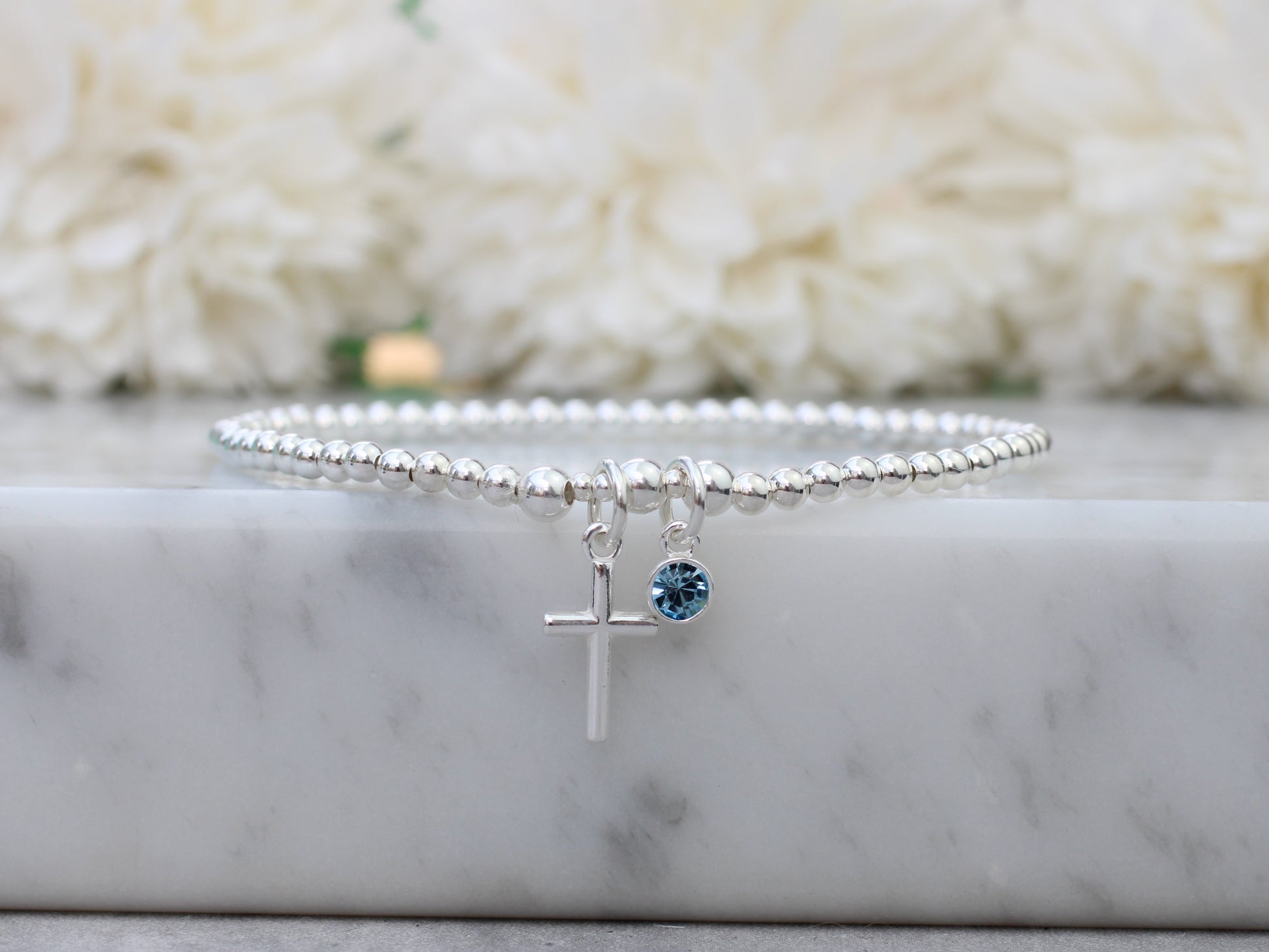 cross and birthstone charm bracelet