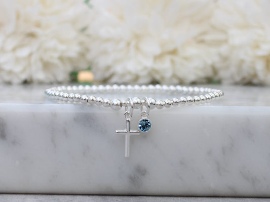 Cross and birthstone crystal charm bracelet.